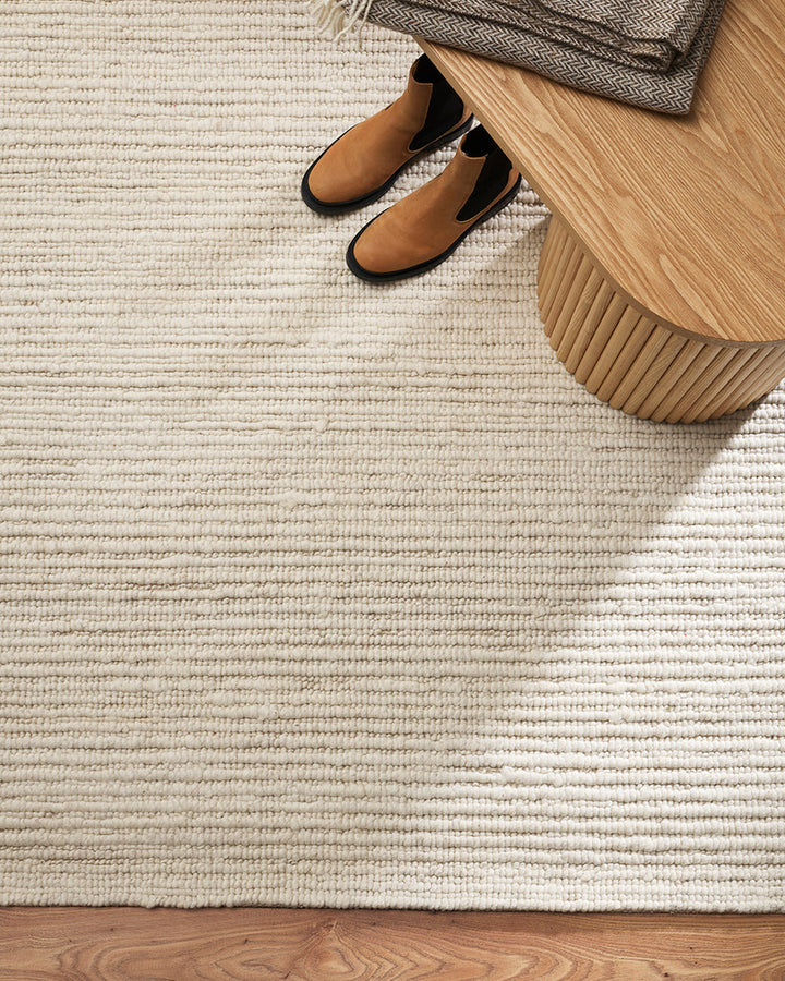 Karaka Floor Rug Create a casualÂ yetÂ refinedÂ look with the natural texture of our KarakaÂ floor rug. Crafted from 100% wool, each rug has been carefully woven by skilled artisans in a tight loop pile design. Natural wool, flecked with grey and black, m