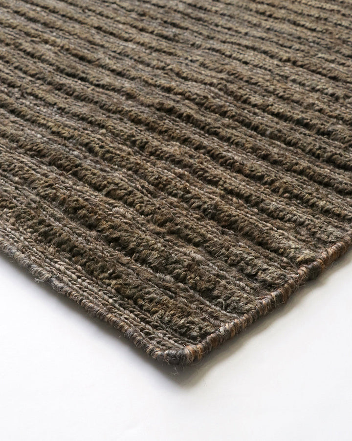 Kencho Floor Rug The tactility of nature is celebrated with this 100% jute floor rug. Created using a braid and tuft design, the Kencho is perfect for creating a laid-back, artisan aesthetic. Rich in texture and colour, this floor rug forms the ideal buil