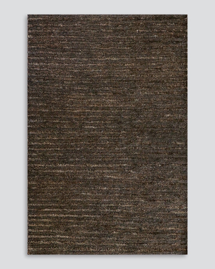 Kencho Floor Rug The tactility of nature is celebrated with this 100% jute floor rug. Created using a braid and tuft design, the Kencho is perfect for creating a laid-back, artisan aesthetic. Rich in texture and colour, this floor rug forms the ideal buil