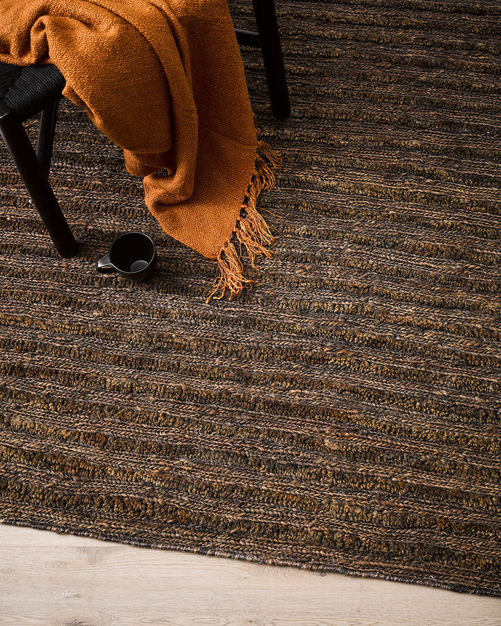 Kencho Floor Rug The tactility of nature is celebrated with this 100% jute floor rug. Created using a braid and tuft design, the Kencho is perfect for creating a laid-back, artisan aesthetic. Rich in texture and colour, this floor rug forms the ideal buil