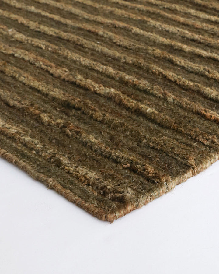 Kencho Floor Rug The tactility of nature is celebrated with this 100% jute floor rug. Created using a braid and tuft design, the Kencho is perfect for creating a laid-back, artisan aesthetic. Rich in texture and colour, this floor rug forms the ideal buil