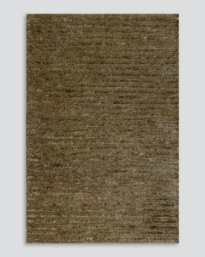 Kencho Floor Rug The tactility of nature is celebrated with this 100% jute floor rug. Created using a braid and tuft design, the Kencho is perfect for creating a laid-back, artisan aesthetic. Rich in texture and colour, this floor rug forms the ideal buil