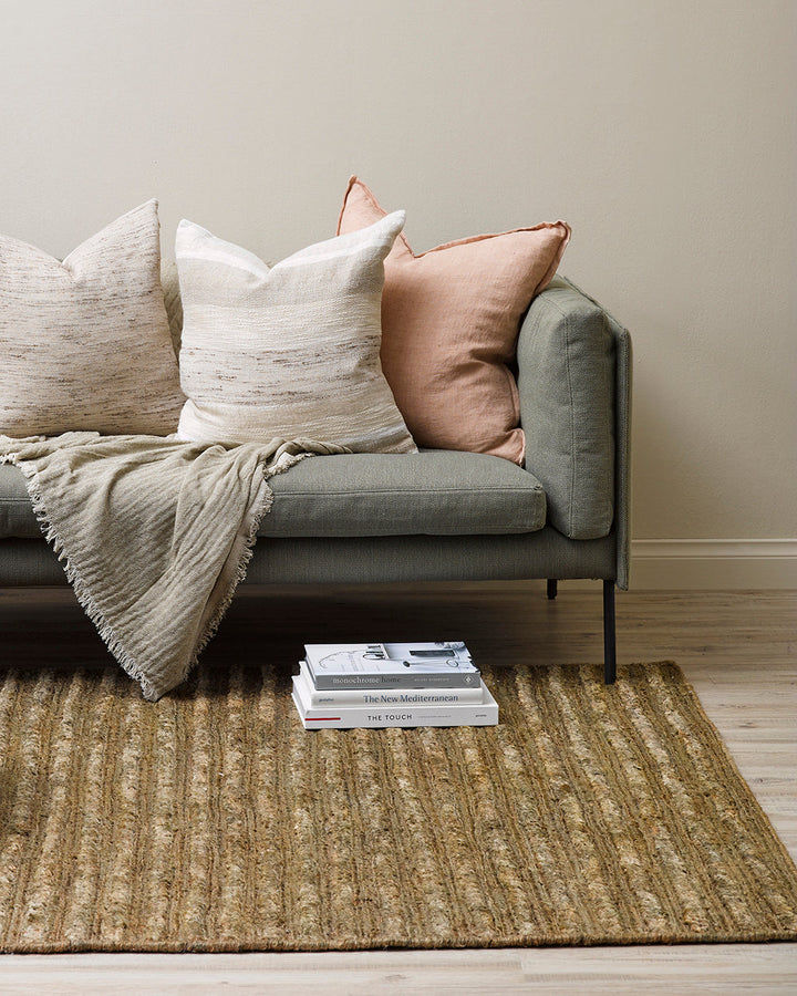 Kencho Floor Rug The tactility of nature is celebrated with this 100% jute floor rug. Created using a braid and tuft design, the Kencho is perfect for creating a laid-back, artisan aesthetic. Rich in texture and colour, this floor rug forms the ideal buil