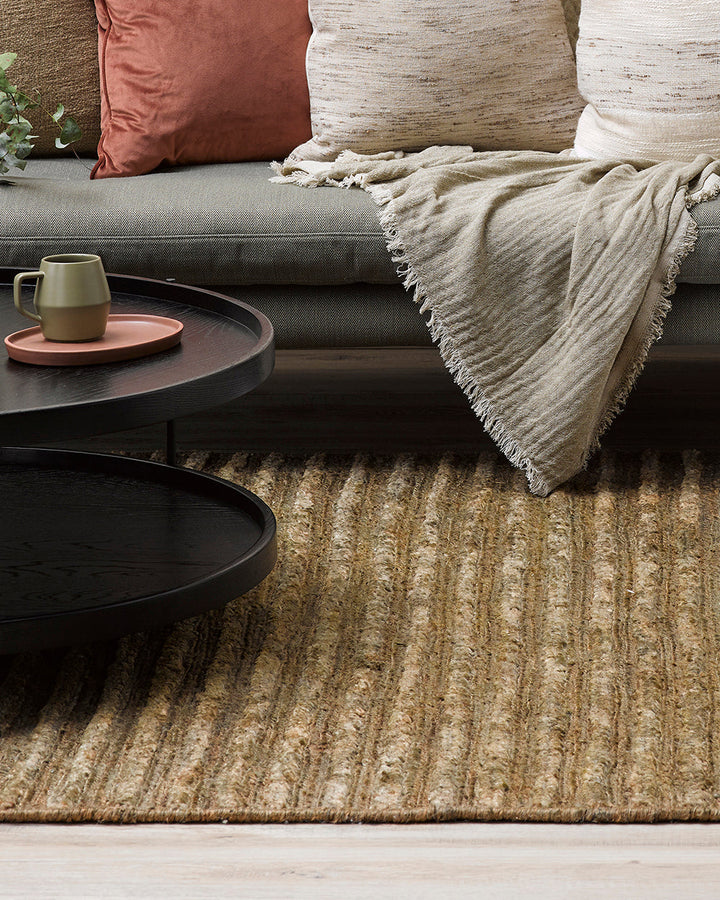 Kencho Floor Rug The tactility of nature is celebrated with this 100% jute floor rug. Created using a braid and tuft design, the Kencho is perfect for creating a laid-back, artisan aesthetic. Rich in texture and colour, this floor rug forms the ideal buil