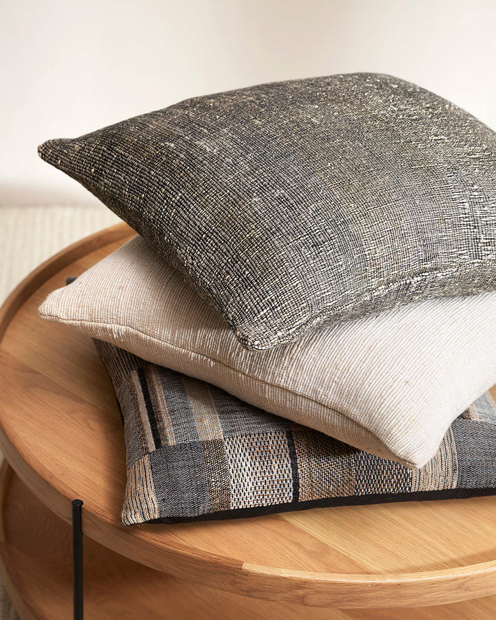 Kentucky Cushion Constructed from sections of artisanal woven fabric, the Kentucky is handcrafted using a stunning blend of wild tussar silk and spun wool. Celebrating natural fibres, this cushion brings a raw and rustic beauty to a space. Pair with clean