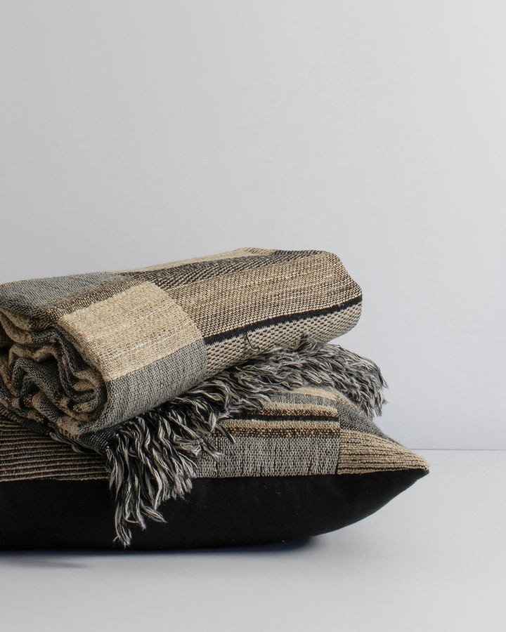 Kentucky Cushion Constructed from sections of artisanal woven fabric, the Kentucky is handcrafted using a stunning blend of wild tussar silk and spun wool. Celebrating natural fibres, this cushion brings a raw and rustic beauty to a space. Pair with clean