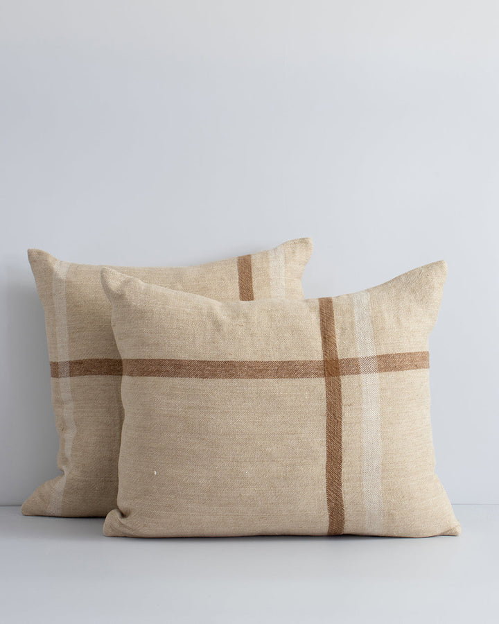 Clintock Cushion Country charm is reinterpreted for urban living in the pared-back design of our Clintock cushion. Tones of treacle, ivory and taupe are woven into an offset, oversized plaid, embodying the â€˜Rustic Retreatâ€™ trend. Comfort and quality g