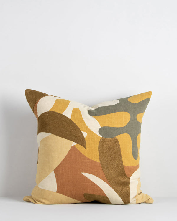 Labyrinth Cushion Inspired by 1950's jungle forms, the design here is confident, with simplified leaf motifs screen-printed onto an ecru ground. Colours are rich, with gentle texture added through sections of matte embroidery. Pair with sister cushion Mas