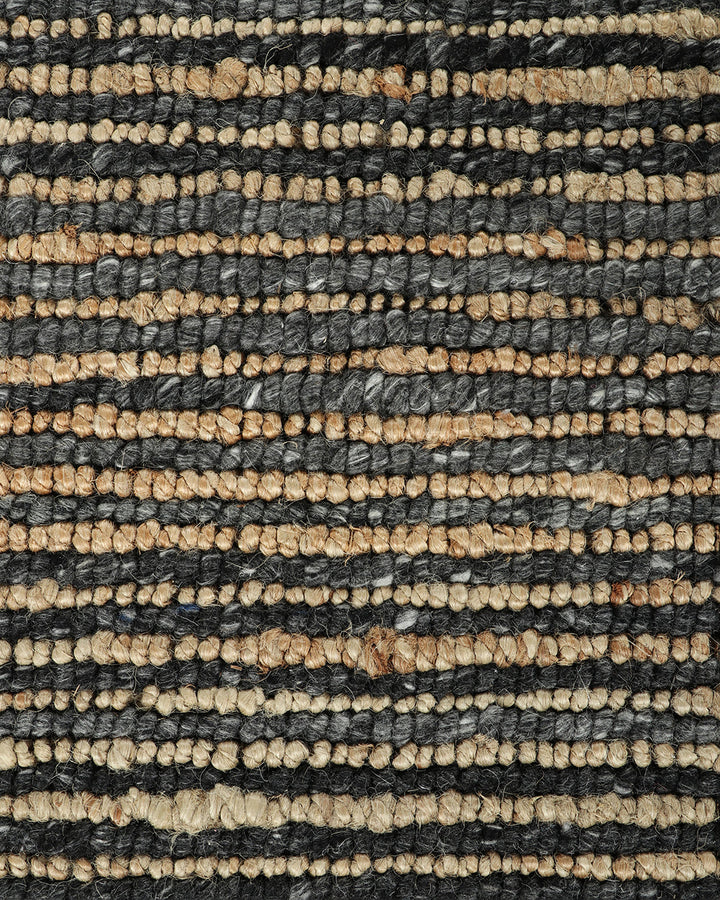 Lima Floor Rug Invite simple, raw texture into your space with the beauty of natural fibres. Handwoven from a stunning blend of jute and wool, the Lima features a stripe pattern in a striking charcoal colourway. An excellent all-rounder for a wide range o