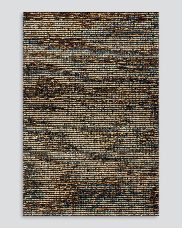 Lima Floor Rug Invite simple, raw texture into your space with the beauty of natural fibres. Handwoven from a stunning blend of jute and wool, the Lima features a stripe pattern in a striking charcoal colourway. An excellent all-rounder for a wide range o