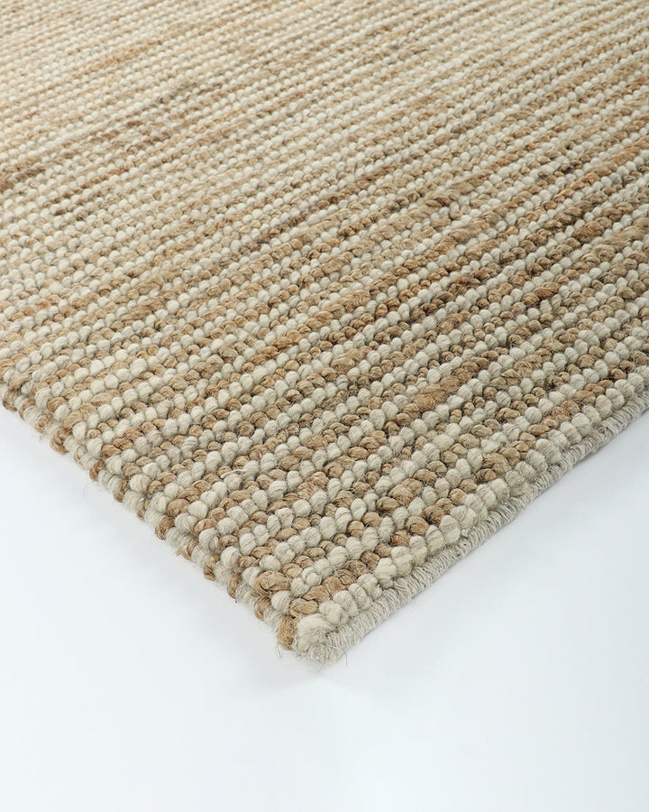 Lima Floor Rug Invite simple, raw texture into your space with the beauty of natural fibres. Handwoven from a stunning blend of jute and wool, the Lima features a stripe pattern in a striking charcoal colourway. An excellent all-rounder for a wide range o