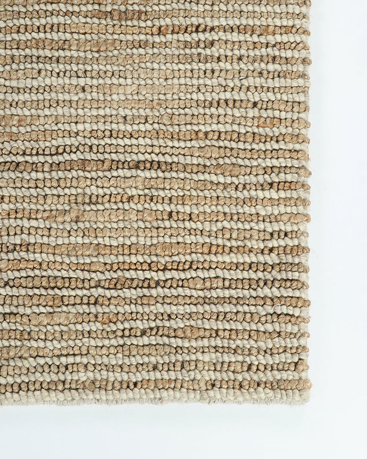 Lima Floor Rug Invite simple, raw texture into your space with the beauty of natural fibres. Handwoven from a stunning blend of jute and wool, the Lima features a stripe pattern in a striking charcoal colourway. An excellent all-rounder for a wide range o