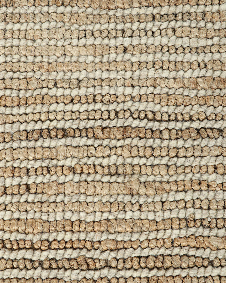 Lima Floor Rug Invite simple, raw texture into your space with the beauty of natural fibres. Handwoven from a stunning blend of jute and wool, the Lima features a stripe pattern in a striking charcoal colourway. An excellent all-rounder for a wide range o