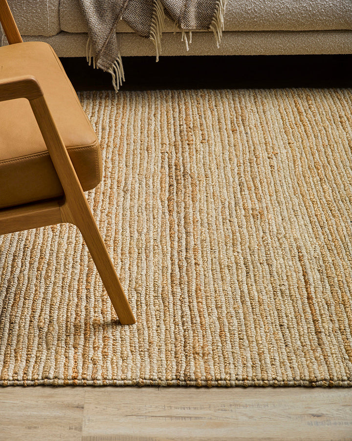 Lima Floor Rug Invite simple, raw texture into your space with the beauty of natural fibres. Handwoven from a stunning blend of jute and wool, the Lima features a stripe pattern in a striking charcoal colourway. An excellent all-rounder for a wide range o