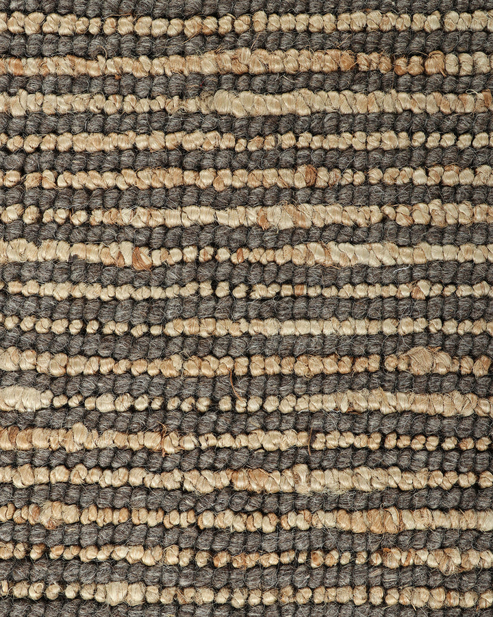 Lima Floor Rug Invite simple, raw texture into your space with the beauty of natural fibres. Handwoven from a stunning blend of jute and wool, the Lima features a stripe pattern in a striking charcoal colourway. An excellent all-rounder for a wide range o