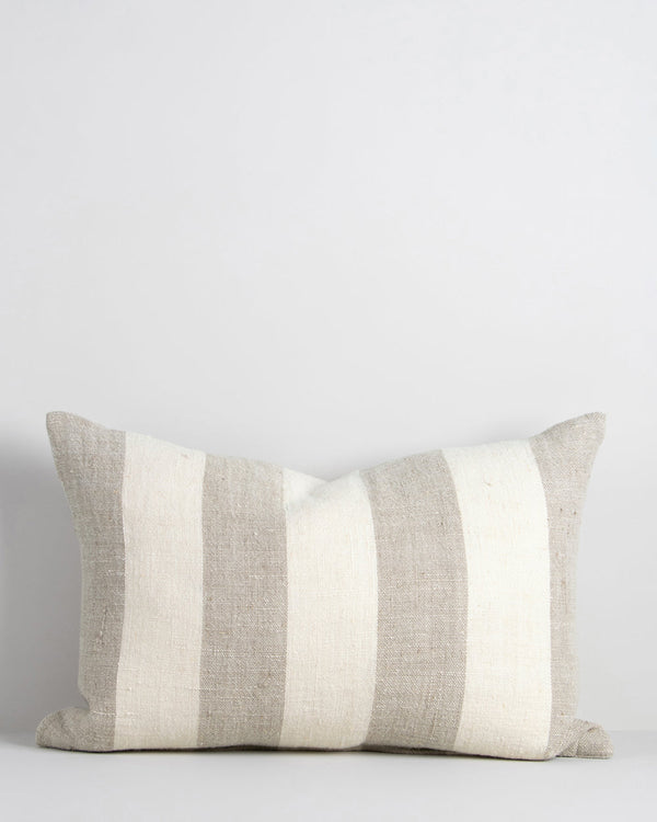 Lowburn Cushion Create a calming, nurturing space with a modern take on coastal style. Perfect for summer, our Lowburn cushion brings breezy and timeless style to interiors. Featuring a wide linear design in textural linen, this lumbar style cushion has b