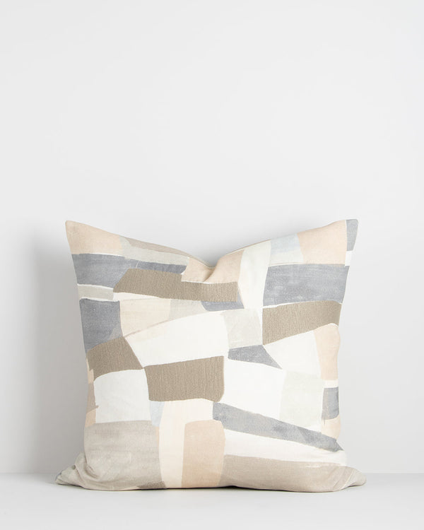 Lucio Cushion Soft tones and abstract shapes come together in the beautiful design of our Lucio cushion. Screen-printed onto a dense cotton base, the hand-painted design calls to mind the ariel aerial view of fields and Mediterranean villages. Sections of