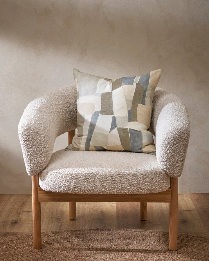 Lucio Cushion Soft tones and abstract shapes come together in the beautiful design of our Lucio cushion. Screen-printed onto a dense cotton base, the hand-painted design calls to mind the ariel aerial view of fields and Mediterranean villages. Sections of