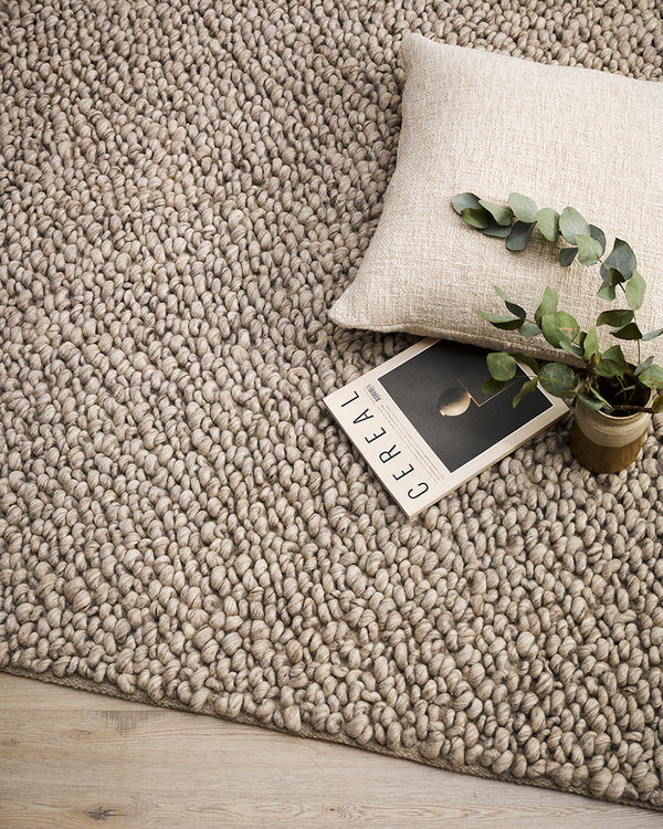 Mackenzie Floor Rug Immerse yourself in the incredible texture of the Mackenzie floor rug. Handcrafted from a blend of New Zealand wool, the generous loop pile feels beautiful underfoot and creates a cosy and relaxed ambiance. The neutral colourway is an