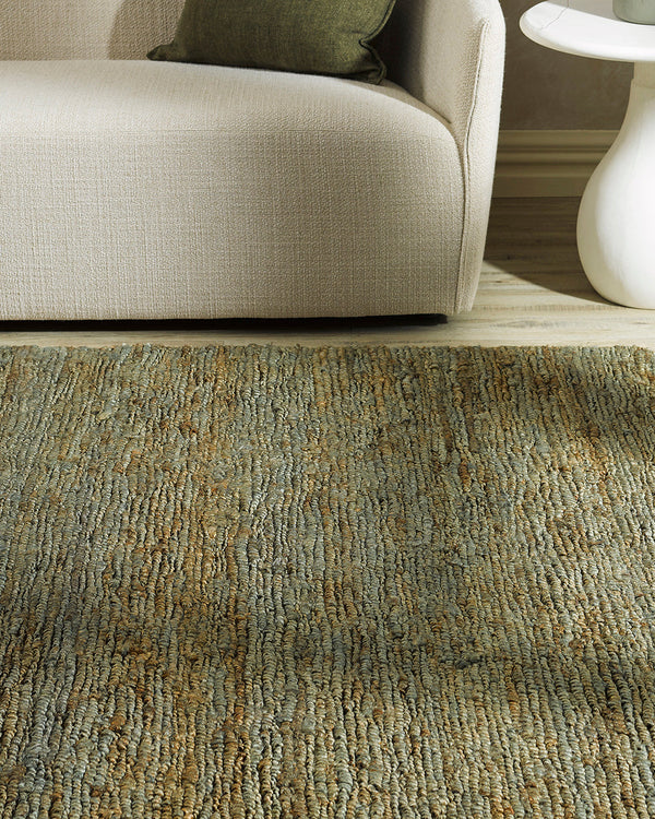 Madagascar Floor Rug Rustic texture is paired with natural earth tones in this remarkable floor rug. Hand-knotted from 100% hemp, the intricately formed loop pattern is subtle yet striking. Easy to style, the natural fibres create a laid-back, relaxed int