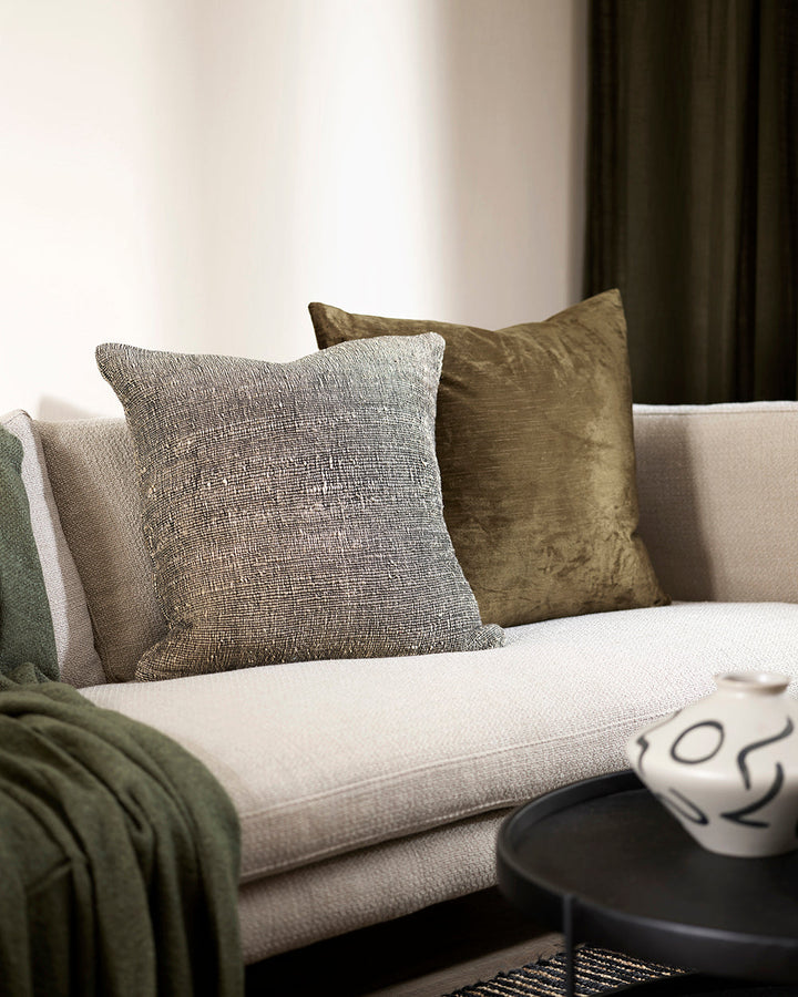 Magnus Cushion The essence of crafted elegance is celebrated in the delicate, irregular surface of the Magnus. Handwoven by skilled artisan makers, the intricate weave reveals the natural grains in the yarn, creating a captivating fabric with beautiful te