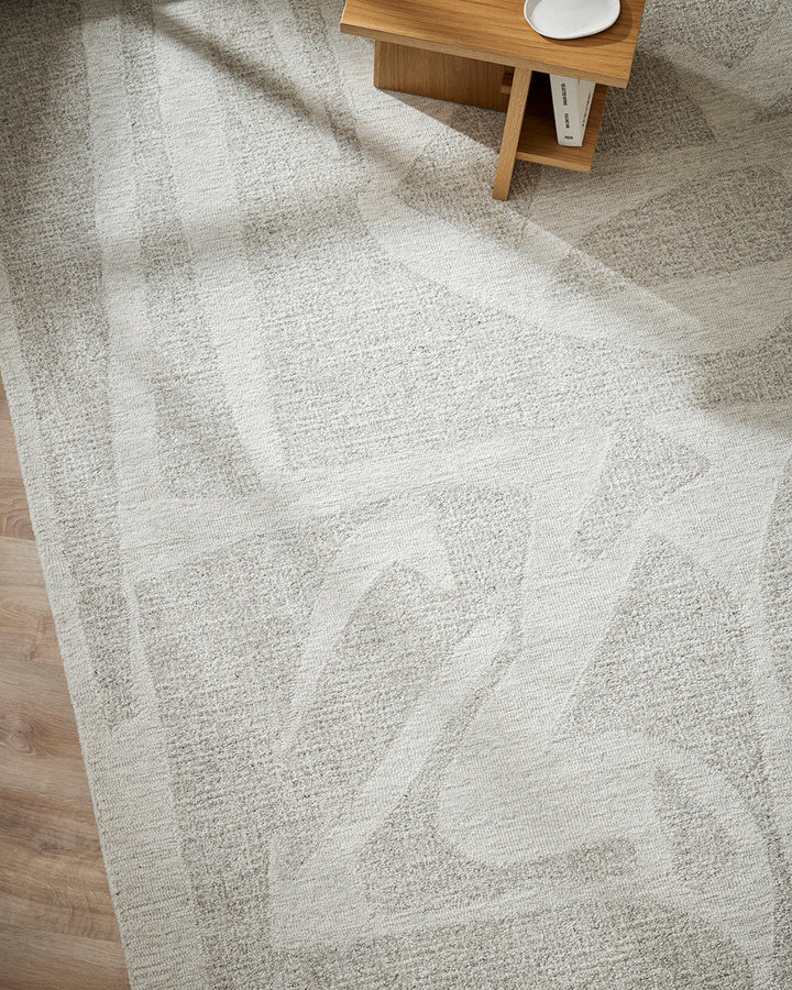 Maya Floor Rug Create a welcoming space with understated design in pure 100% wool. Inspired by the mineral lines in coastal rocks, the Maya rug’s abstract design and sand tones evoke a natural sense of warmth and style. Soft and supportive underfoot, the