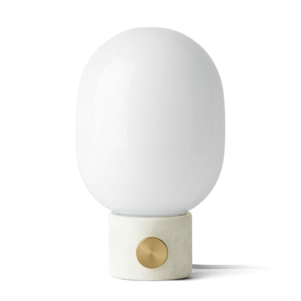 Audo CPH JWDA Table Lamp by Audo Copenhagen - The JWDA Lamp is an immediate statement piece, combining sculptural appeal with room-transforming presence. Its design features a striking balance between the fragile, curved glass and the robust metal base, c