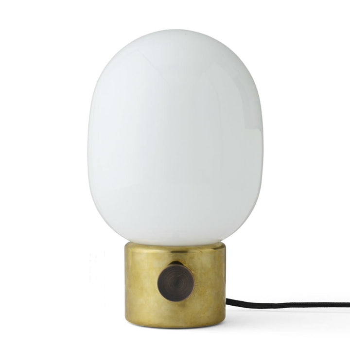 Audo CPH JWDA Table Lamp by Audo Copenhagen - The JWDA Lamp is an immediate statement piece, combining sculptural appeal with room-transforming presence. Its design features a striking balance between the fragile, curved glass and the robust metal base, c