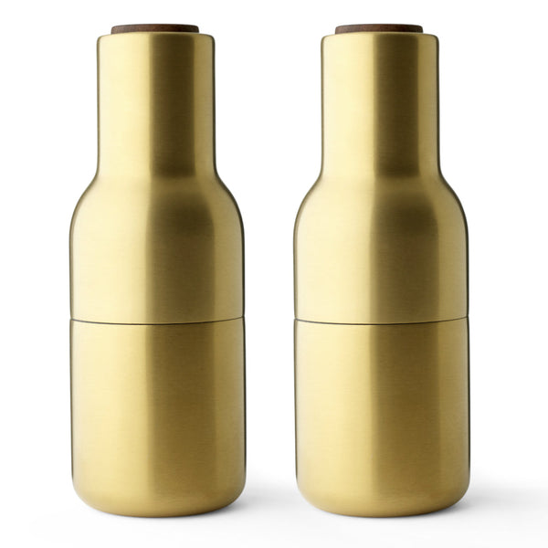 Audo CPH Bottle Grinders - Brass by Audo Copenhagen - Designed in the shape of a bottle, this form encourages a playful and exploratory use. The strong ceramic mechanism provides smooth operation, ideal for grinding various dried spices, seeds, salt, and
