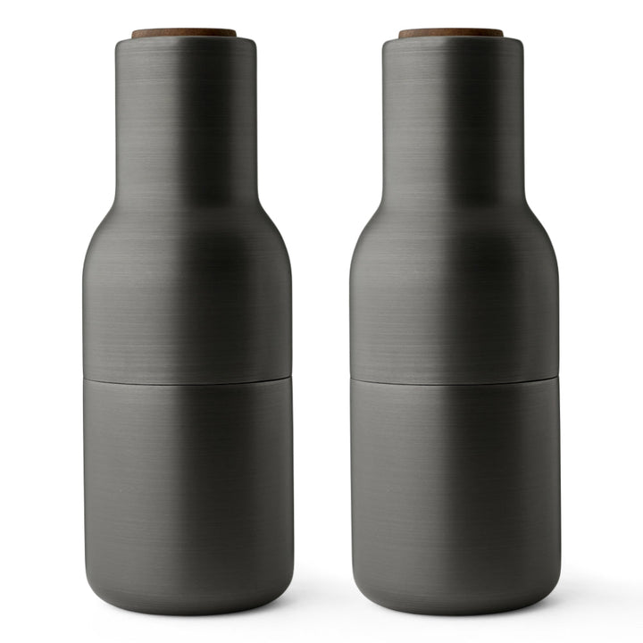 Audo CPH Bottle Grinders - Brass by Audo Copenhagen - Designed in the shape of a bottle, this form encourages a playful and exploratory use. The strong ceramic mechanism provides smooth operation, ideal for grinding various dried spices, seeds, salt, and