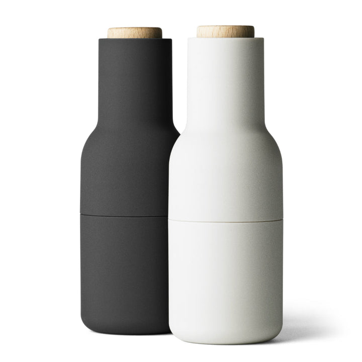 Audo CPH Bottle Grinders by Audo Copenhagen - The bottle-shaped design invites a playful and experimental approach to grinding. Equipped with a robust ceramic mechanism, this grinder effortlessly handles a variety of dried spices, seeds, salt, and pepper.