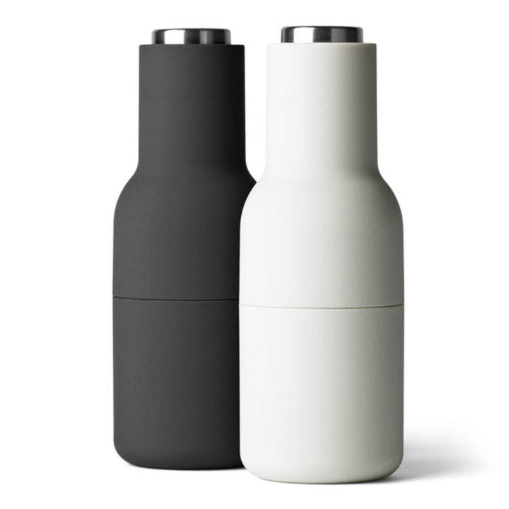 Audo CPH Bottle Grinders by Audo Copenhagen - The bottle-shaped design invites a playful and experimental approach to grinding. Equipped with a robust ceramic mechanism, this grinder effortlessly handles a variety of dried spices, seeds, salt, and pepper.