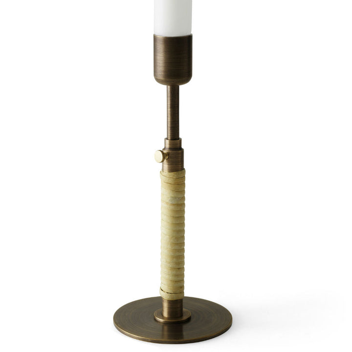 Audo CPH Duca Candle Holder by Audo Copenhagen - Named after the Latin term for "extend," the Duca candle holder allows height adjustment by loosening the screw on its slender stem as the candle burns. Crafted from polished or bronzed brass and accented w
