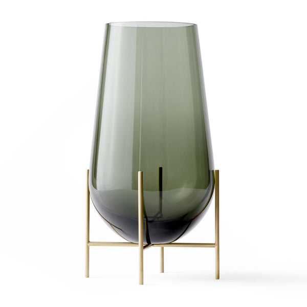 Audo CPH Echasse Vase - Medium by Audo Copenhagen - The Échasse Collection reinterprets the timeless elegance of glass vases and bowls by combining a minimalist profile with a refined, playful character suited for both modern and classic interiors. Theres