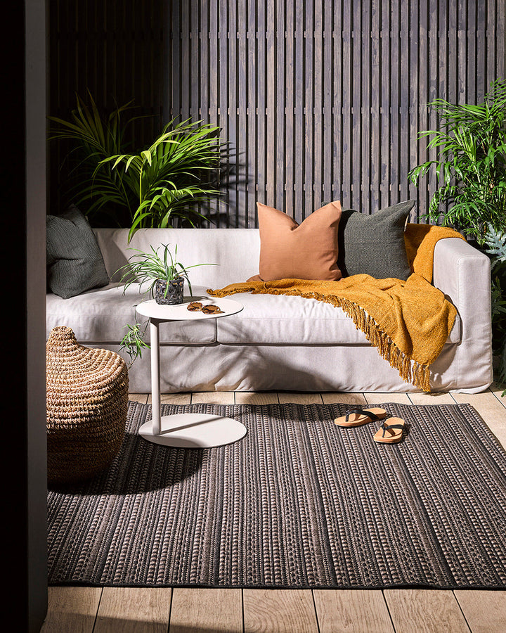 Mendoza Floor Rug Suitable for use both in and outdoors, the Mendozaâ€™s finely patterned weave and timeless colourway provides the perfect base for styling a refined exterior space. The understated design makes this piece easy to pair with flooring and f