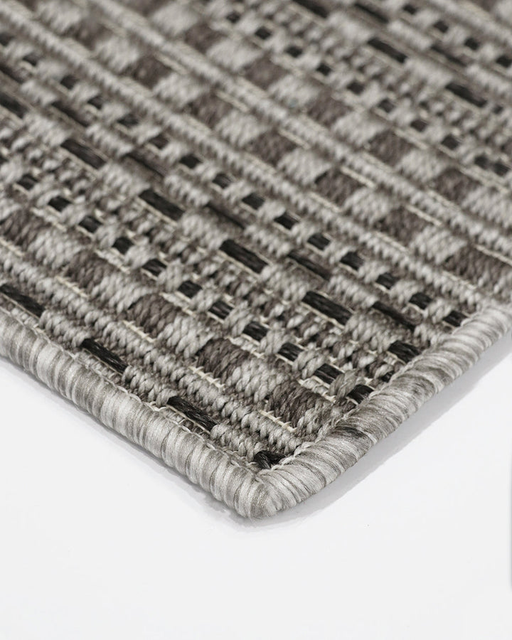 Mendoza Floor Rug Suitable for use both in and outdoors, the Mendozaâ€™s finely patterned weave and timeless colourway provides the perfect base for styling a refined exterior space. The understated design makes this piece easy to pair with flooring and f