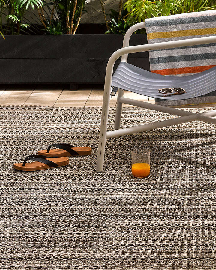 Mendoza Floor Rug Suitable for use both in and outdoors, the Mendozaâ€™s finely patterned weave and timeless colourway provides the perfect base for styling a refined exterior space. The understated design makes this piece easy to pair with flooring and f