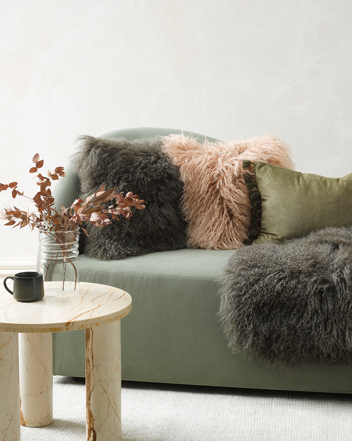 Meru Tibetan Lamb Cushion Bring a cosy, inviting feel to a room with the impossibly soft texture of Tibetan lamb fur. Gorgeously shaggy with a natural curl, the Meru engages senses with its sumptuous tactility, and restful silver tone. Style with matching