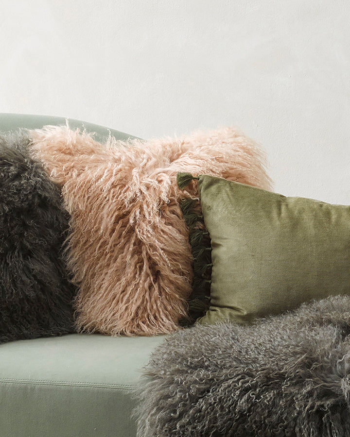 Meru Tibetan Lamb Cushion Bring a cosy, inviting feel to a room with the impossibly soft texture of Tibetan lamb fur. Gorgeously shaggy with a natural curl, the Meru engages senses with its sumptuous tactility, and restful silver tone. Style with matching