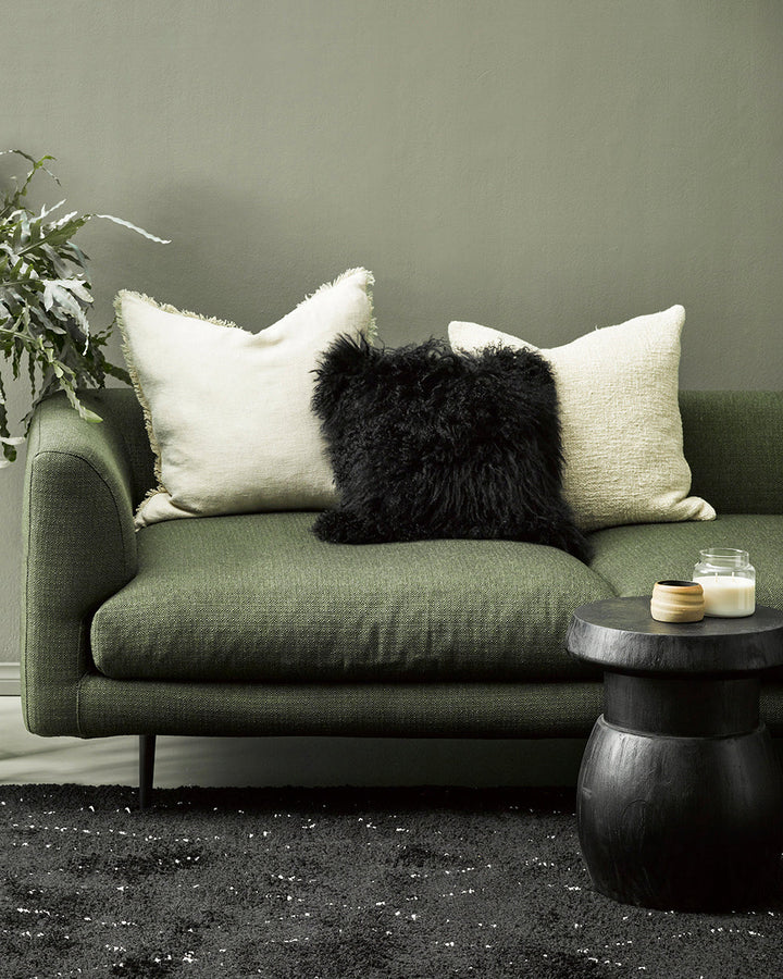 Meru Tibetan Lamb Cushion Bring a cosy, inviting feel to a room with the impossibly soft texture of Tibetan lamb fur. Gorgeously shaggy with a natural curl, the Meru engages senses with its sumptuous tactility, and restful silver tone. Style with matching