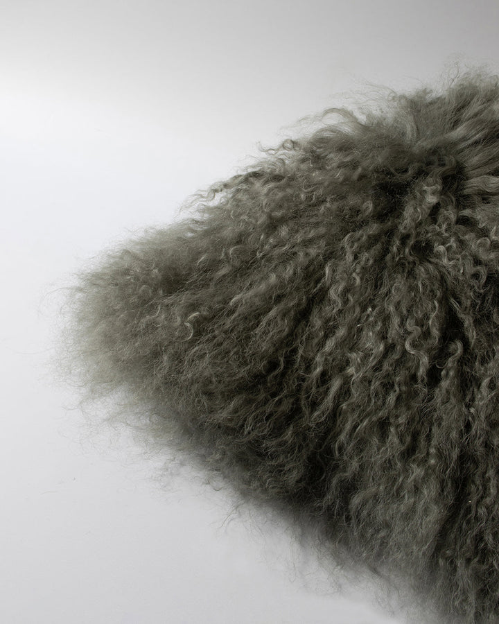 Meru Tibetan Lamb Cushion Bring a cosy, inviting feel to a room with the impossibly soft texture of Tibetan lamb fur. Gorgeously shaggy with a natural curl, the Meru engages senses with its sumptuous tactility, and restful silver tone. Style with matching