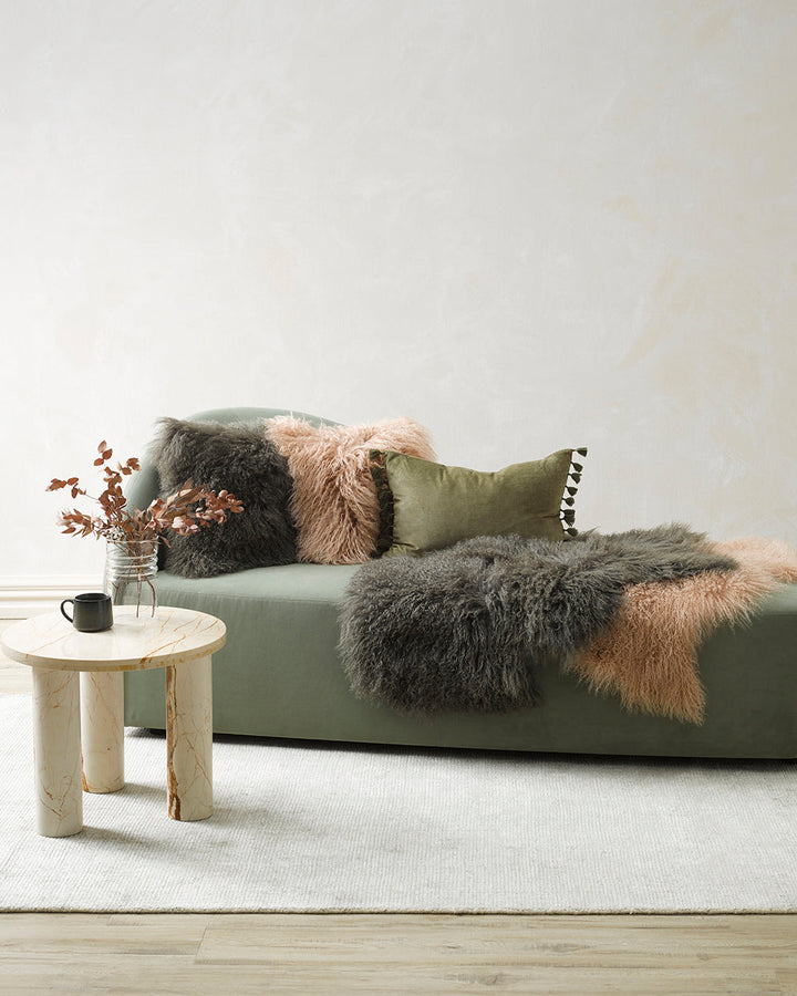 Meru Tibetan Lamb Cushion Bring a cosy, inviting feel to a room with the impossibly soft texture of Tibetan lamb fur. Gorgeously shaggy with a natural curl, the Meru engages senses with its sumptuous tactility, and restful silver tone. Style with matching