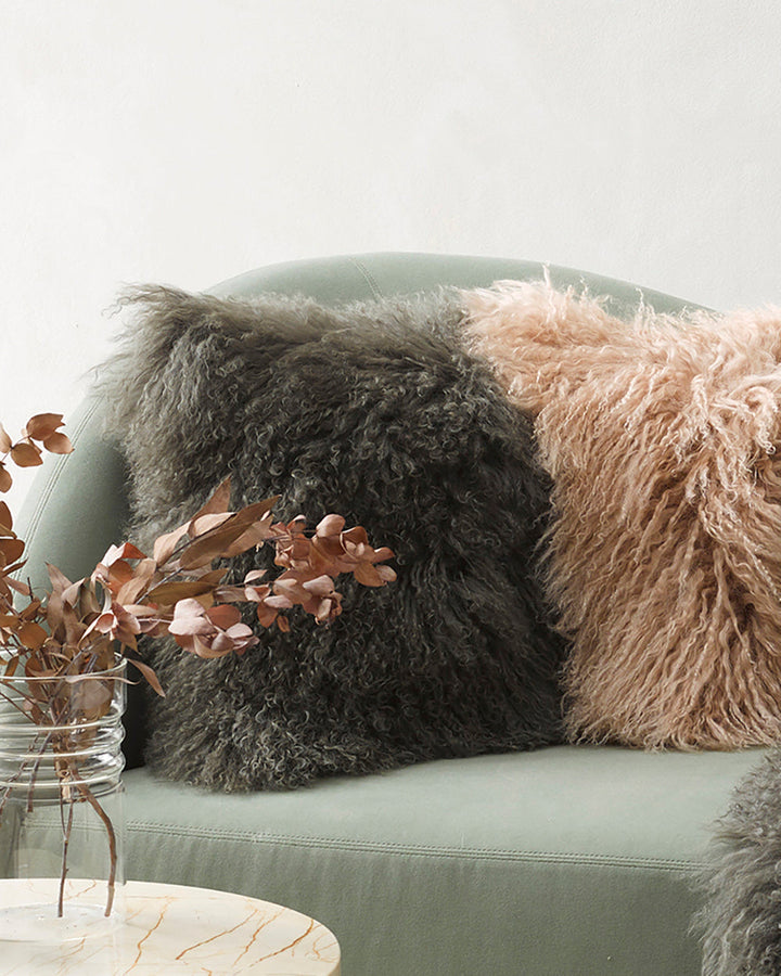 Meru Tibetan Lamb Cushion Bring a cosy, inviting feel to a room with the impossibly soft texture of Tibetan lamb fur. Gorgeously shaggy with a natural curl, the Meru engages senses with its sumptuous tactility, and restful silver tone. Style with matching