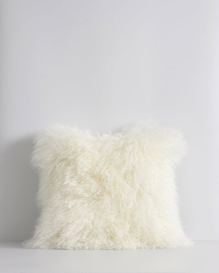 Meru Tibetan Lamb Cushion Bring a cosy, inviting feel to a room with the impossibly soft texture of Tibetan lamb fur. Gorgeously shaggy with a natural curl, the Meru engages senses with its sumptuous tactility, and restful silver tone. Style with matching