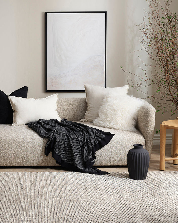 Meru Tibetan Lamb Cushion Bring a cosy, inviting feel to a room with the impossibly soft texture of Tibetan lamb fur. Gorgeously shaggy with a natural curl, the Meru engages senses with its sumptuous tactility, and restful silver tone. Style with matching