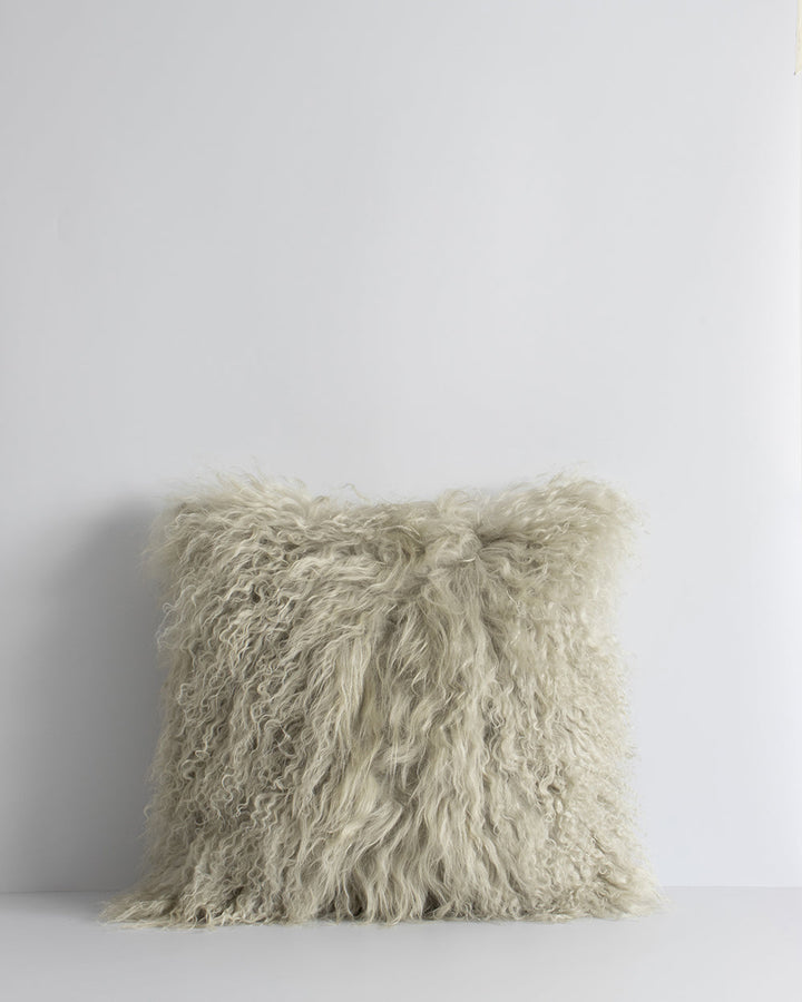 Meru Tibetan Lamb Cushion Bring a cosy, inviting feel to a room with the impossibly soft texture of Tibetan lamb fur. Gorgeously shaggy with a natural curl, the Meru engages senses with its sumptuous tactility, and restful silver tone. Style with matching