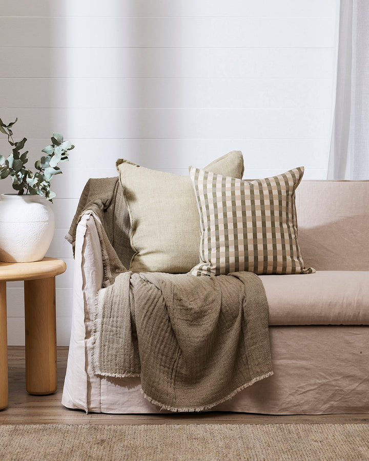 Mia Cushion Vintage cottage charm is reinterpreted for modern living with our Mia cushion. A screen-printed gingham design in shades of sage, ecru and almond creates an inviting and comforting aesthetic. Pair with our Aria Cushion for a contemporary, info