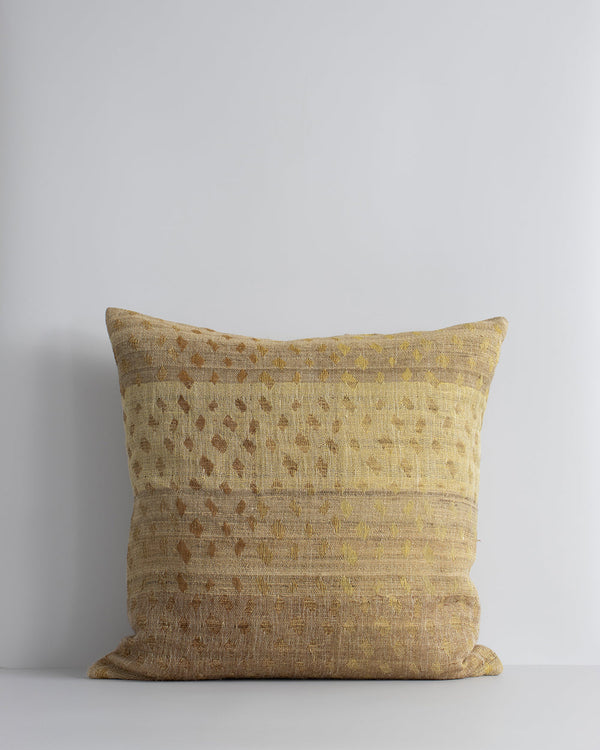 Mojave Cushion Celebrating the beauty of artisanal woven fabric, Mojave is a stunning textural piece in earthy shades of biscuit, gold and caramel. Handwoven in a silk-linen blend, the delicate surface design creates a warm and uplifting artisan aesthetic