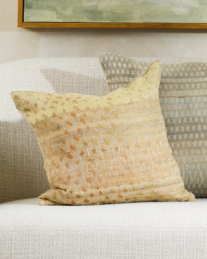 Mojave Cushion Celebrating the beauty of artisanal woven fabric, Mojave is a stunning textural piece in earthy shades of biscuit, gold and caramel. Handwoven in a silk-linen blend, the delicate surface design creates a warm and uplifting artisan aesthetic