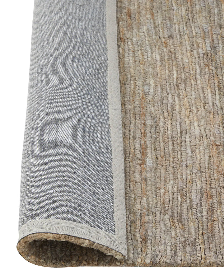 Bastian Fossil - Natural Jute Rug Discover the Bastian Fossil rug, a handcrafted jute masterpiece offering durability and unique texture for your home.